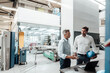 © KNSY/Westend61 - Male engineers discussing over laptop in manufacturing industry