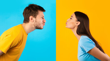 Wall Mural - Man and woman reaching to each other trying to kiss