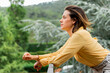 © VITTA GALLERY/Westend61 - Young woman enjoying view from balcony