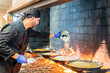 © Javier De La Torre Sebastian/Westend61 - Traditional cooking of paella in restaurant kitchen