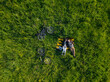 © Konstantin Trubavin/Westend61 - Couple lying on grass, aerial view