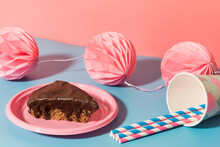 Chocolate Cake, Tissue Paper¬†pom-poms¬†and Paper Cups And Straws