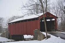 Red Covered Bridge In Winter Snow In Lancaster County P. A.