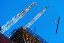 USA, New York State, New York City, Manhattan, Low Angle View Of Cranes On Construction Site