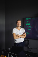 Portrait of smiling IT professional working on projection screen in creative office