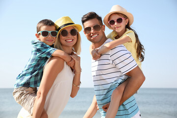 Sticker - Happy family at beach on sunny summer day