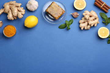 Flat lay composition with fresh products on blue background, space for text. Natural antibiotics