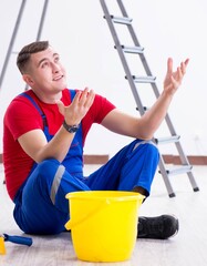 Wall Mural - Male painter preparing for painting job at construction site