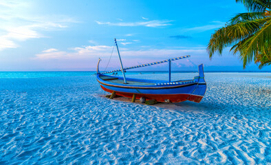 View of nice tropical beach with old boat