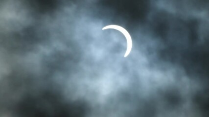 Wall Mural - earth shadow covering the moon on the night sky, forming a lunar eclipse, with clouds in front