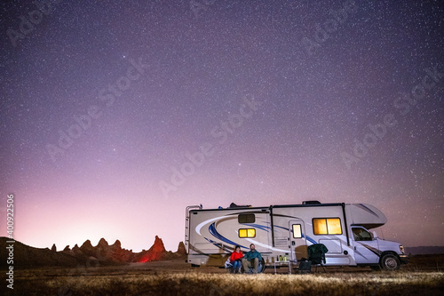 Couple gazes at the stars while camping