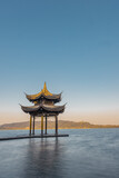 Fototapeta  - Sunrise view of Jixian pavilion, the landmark at the west lake in Hangzhou, China.