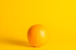 Orange fruit on yellow background
