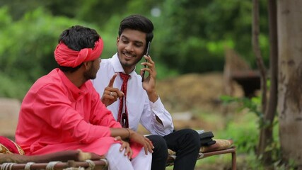 Sticker - Young indian farmer with agronomist or banker at home