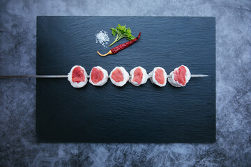 Wall Mural - Skewers of fresh and raw shish kebab or barbecued shashlik meat. 