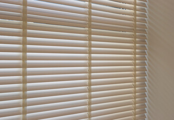 Leinwandbilder - Wood blinds closeup in the interior. Automatic venetian blinds beige color on large windows. Wooden slats 50mm wide. Wood floor, beige walls.