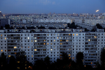 Wall Mural - Light in the houses of the sleeping area in the evening. Moscow, Russia.