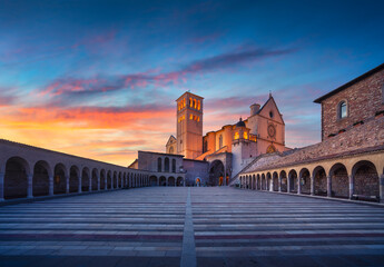 Wall Mural - Assisi, San Francesco Basilica church at sunset. Umbria, Italy.