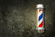 Barber Pole. Barbershop Pole On A Textured Background With Copy Space.