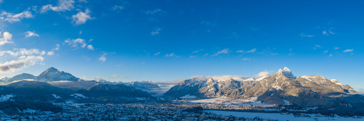 Wall Mural - Panorama at sunrise in reutte on a winter's day with mountains thaneller and hahnenkamm