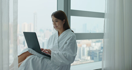 Sticker - Woman work on laptop computer and sit beside window