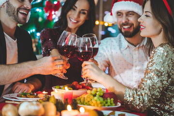 Friends having Christmas eve dinner at home