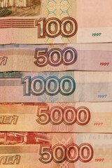 Wall Mural - Russian banknotes of various denominations. In denominations of 5000, 1000, 500 and 100. Vertical.