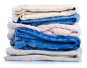 Wall Mural - Stack folded jeans sweaters on white background isolation