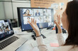 © Paul Bradbury/Caia Image - Businesswoman video conferencing with coworkers at computer screen