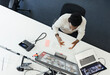 © Paul Bradbury/Caia Image - Businessman video conferencing at computer in office