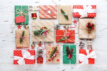 Sticker - Gift boxes with ornaments on white wooden background