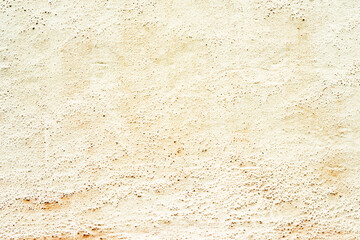 Texture of a concrete wall with cracks and scratches which can be used as a background