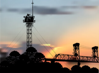 Canvas Print - antenna tower silhouettes near bridge at orange sunset