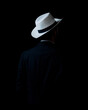 © Antonio - low key portrait of young men with hat in the darkness.