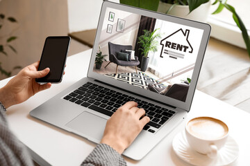 Woman searching for apartment on rental property website via laptop, closeup