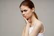 © SHOTPRIME STUDIO - beautiful woman touching face with hand toothache red hair white t-shirt