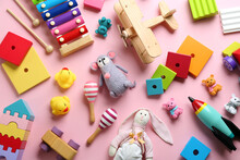 Different Toys On Pink Background, Flat Lay
