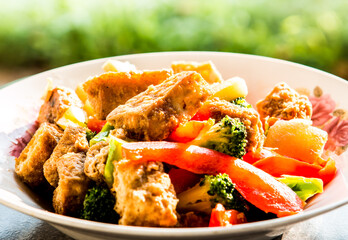 Wall Mural - Fried tofu with broccoli and bell pepper in plate, in door  Chiangmai  Thailand