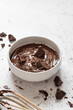 © The Picture Pantry - Bowl of melted chocolate with wooden whisk