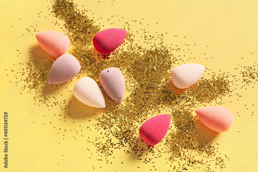 Makeup sponges on color background