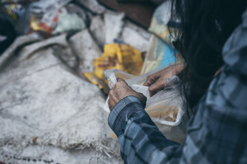 Wall Mural - poor people,homeless or beggar begging for help sitting at dirty slum.concept for poverty hunger,human rights,donate and charity for underprivileged children in third world