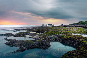 Wall Mural - abstract long exposure photography of sea beach rock landscape seascape during epic sunset, calm tranquil meditative quiet