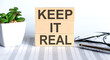 KEEP IT REAL text on the wooden cubes on chart
