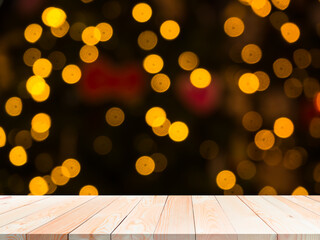 Bokeh for happy new year 2021 concept. Blank wood table on blur abstract bokeh for background.