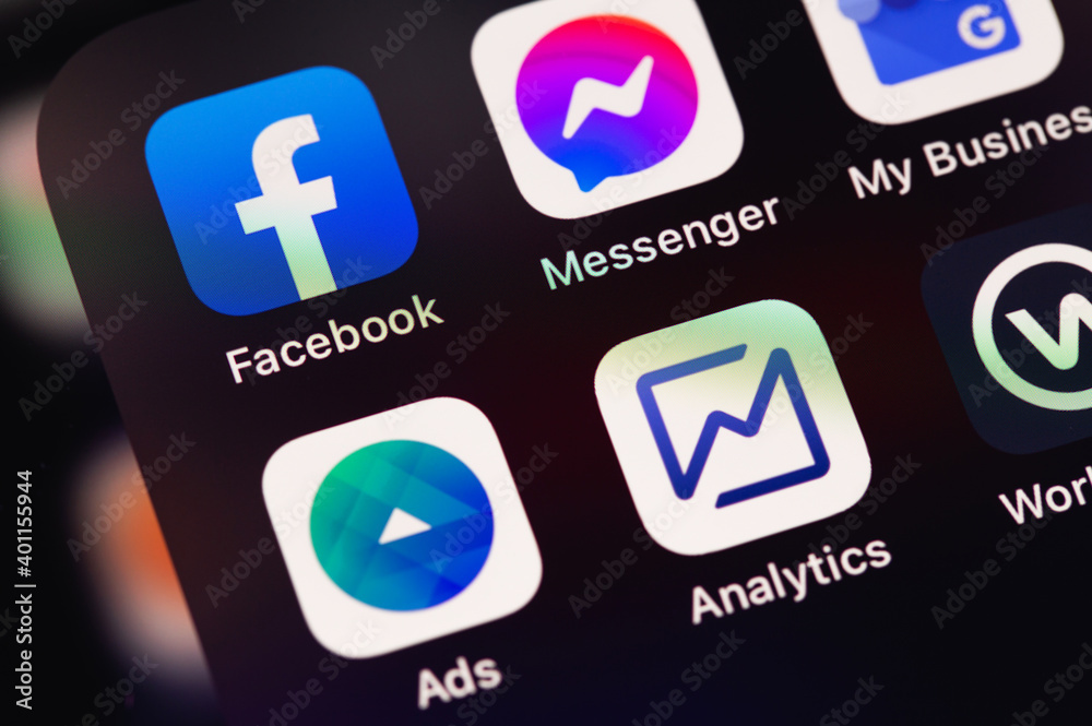Facebook, Ads, Analytics mobile apps on the screen iPhone with EarPods ...