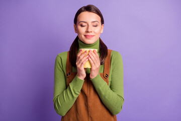 Canvas Print - Portrait of lovely cheery dreamy girl drinking beverage resting free time isolated over bright violet color background