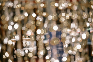 Wall Mural - Gold glitter vintage lights background. defocused