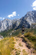 © Edgar - Hombre joven senderista contemplando las vistas de las montañas en el parque nacional de los picos de europa dirigiendose a collado jermososo.