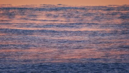 Sticker - The Black sea with waves and fog over the surface at sunrise. Sochi, Russia