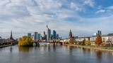 Fototapeta Londyn - Frankfurt, Germany, November 2020: view on Frankfurt am Main, Germany Financial District and skyline, picture taken on bridge at main river